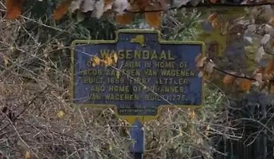 Historical marker sign reading: Wagendaal — On this farm is home of Jacob Aartsen Van Wagenen, built 1659, first settler, and home of Johannes Van Wagenen, built 1775.